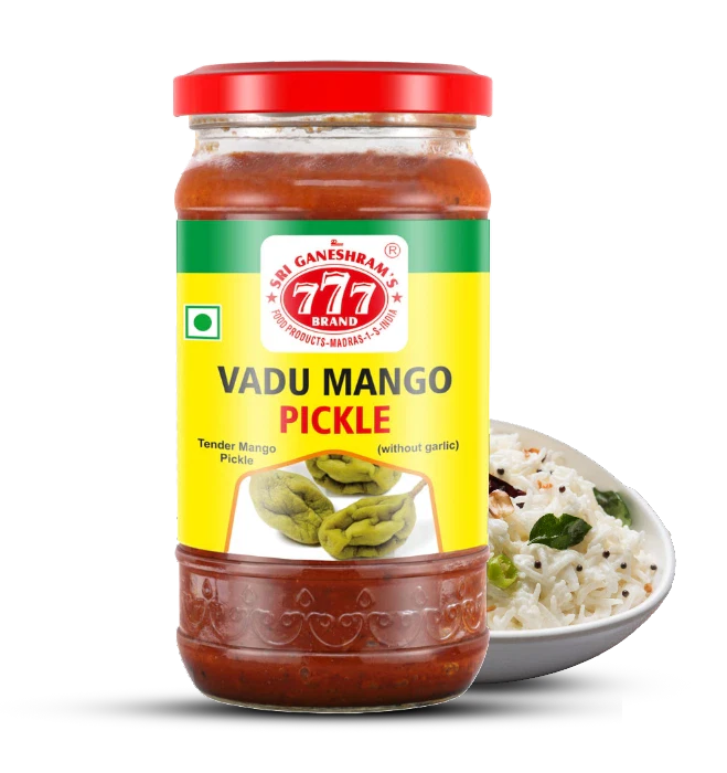 Authentic Vadu Mango Pickle in a jar, made with tender baby mangoes, aromatic spices, and oil for a tangy and mildly spicy flavor.